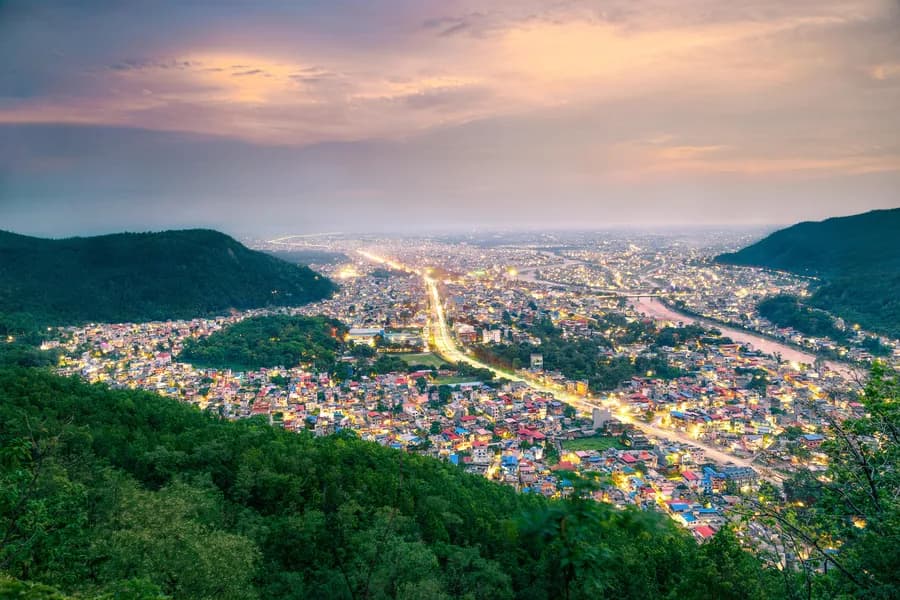 Butwal lit up at dusk, seen from the surrounding hills